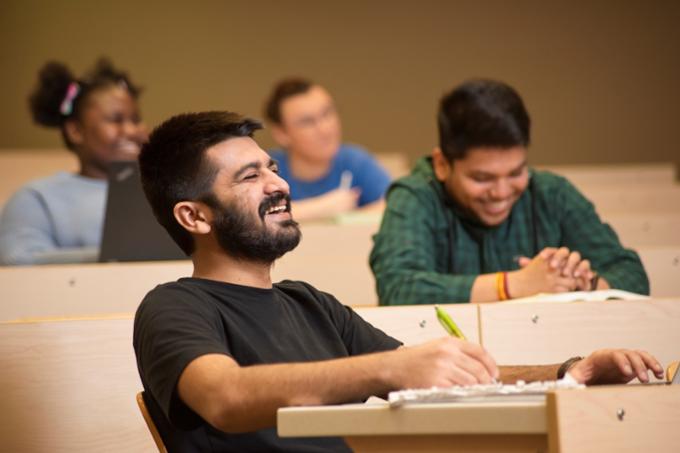 Smiling students in a lecture theatre