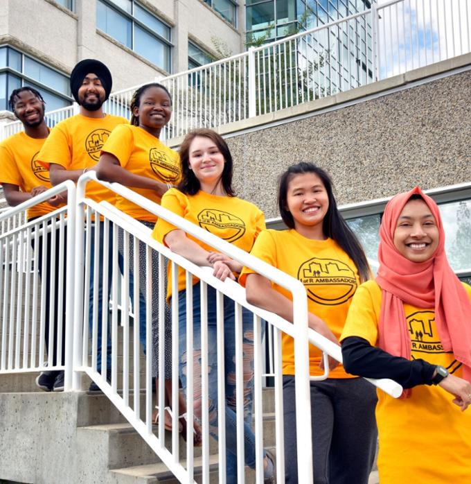 Group of students posing on stairs