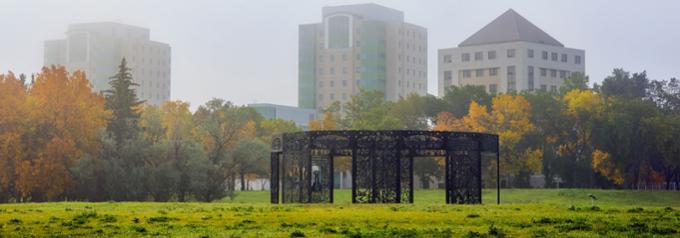 Fafard Sculpture with U of R buildings in the background
