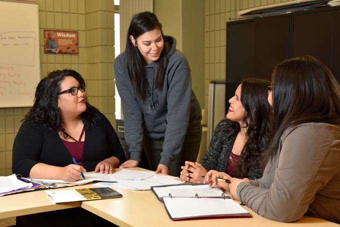 Four students studying at a table