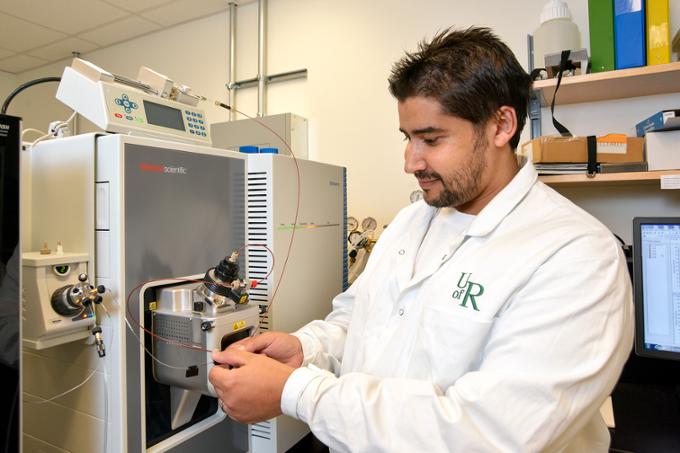 Man working with a scientific machine