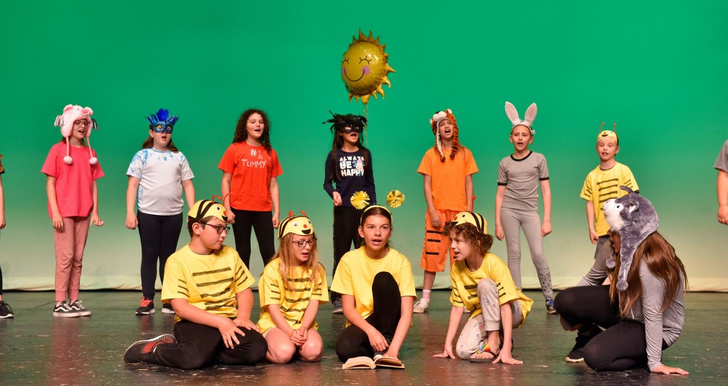 youth performing on stage at Darke Hall