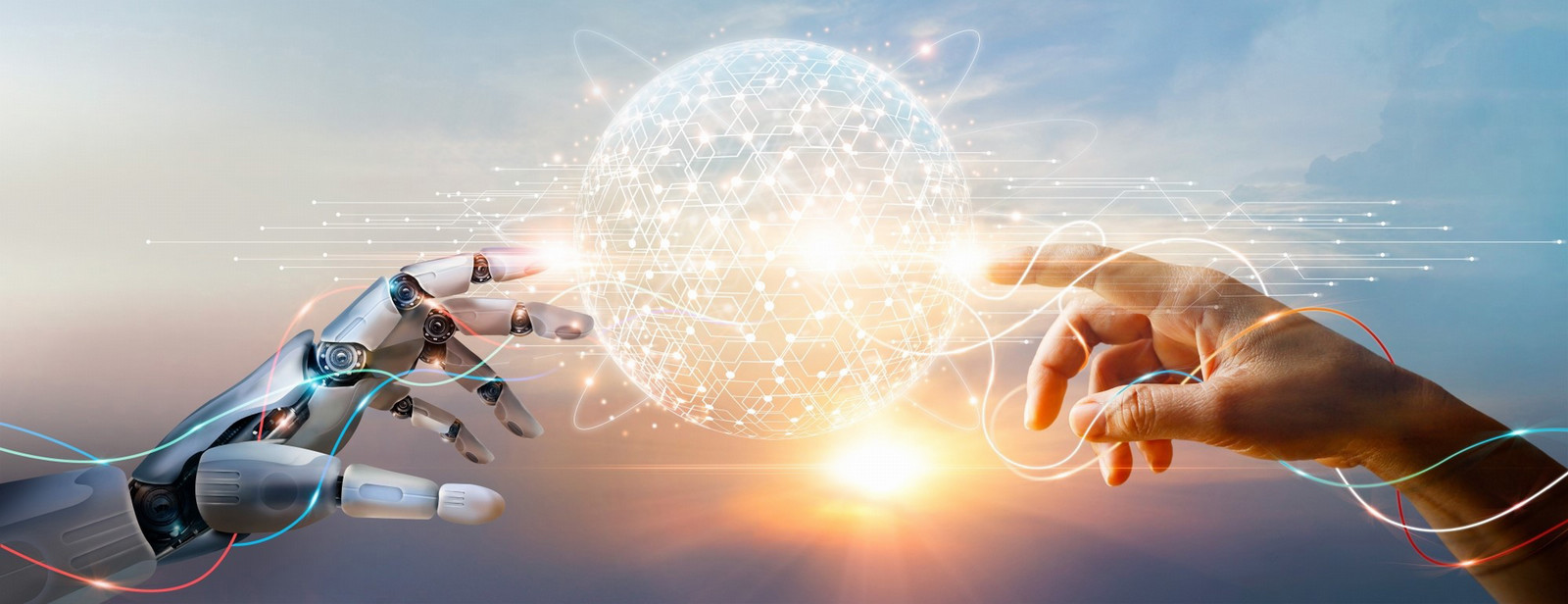 Human hand and robotic hand reaching toward a glowing digital sphere