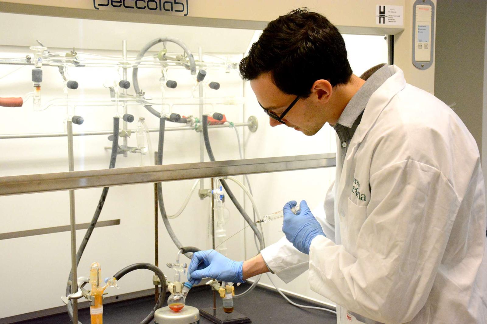 Student using sensitive scientific equipment