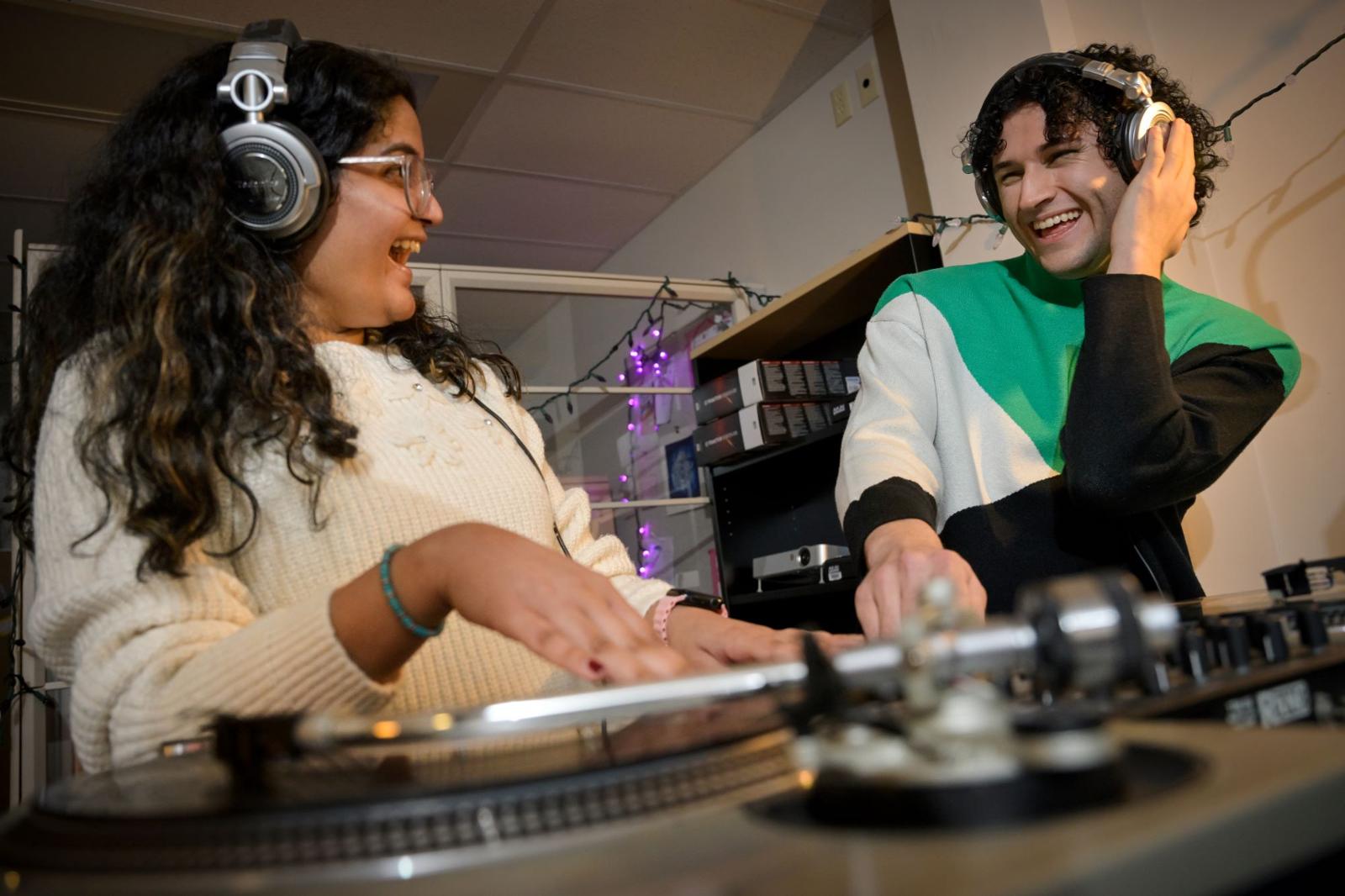 two students using a turntable