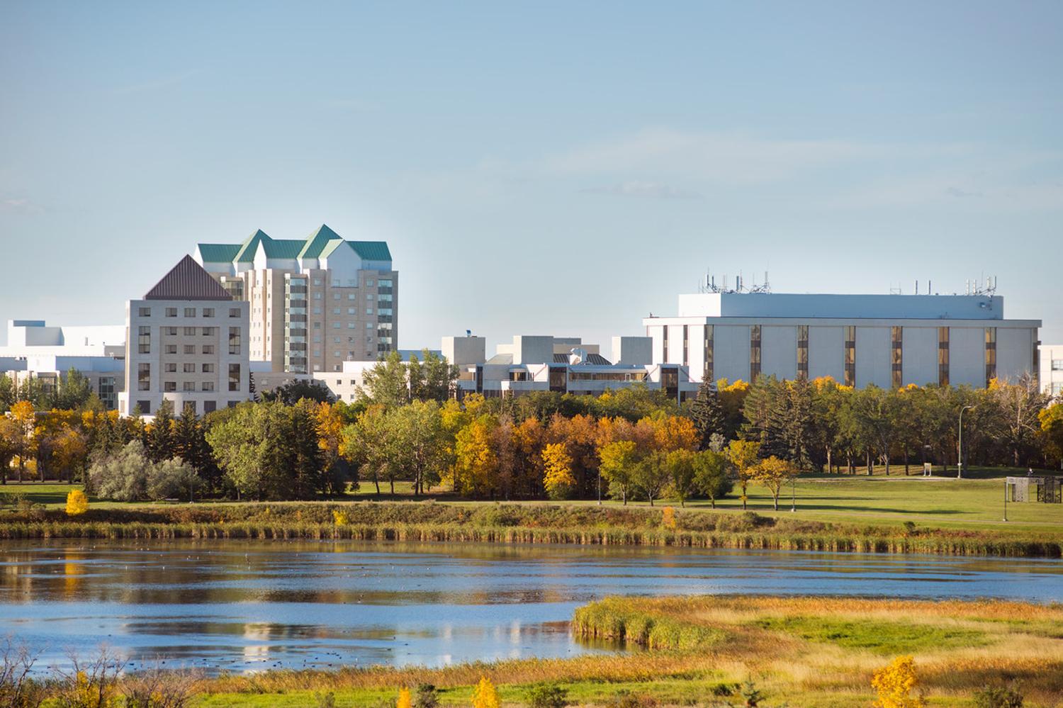 Skyline view of U of R campus seen from across Wascana Lake. 