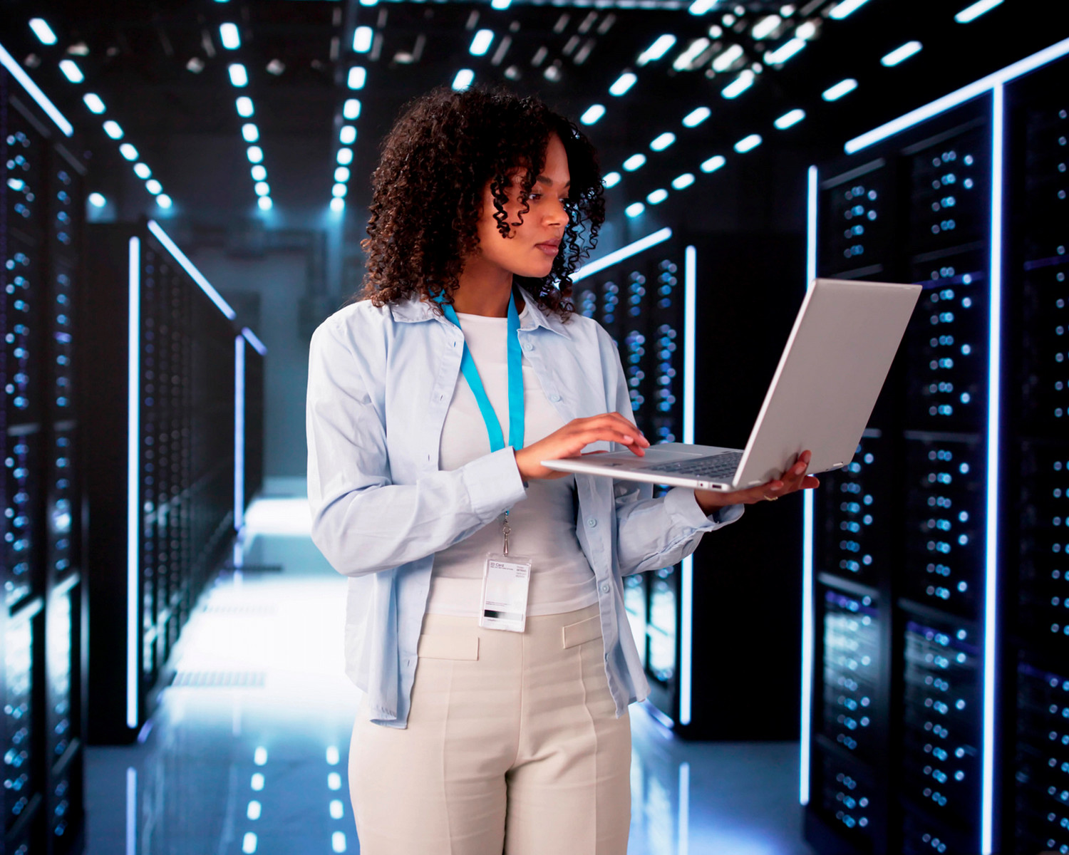 a woman walking while using a computer