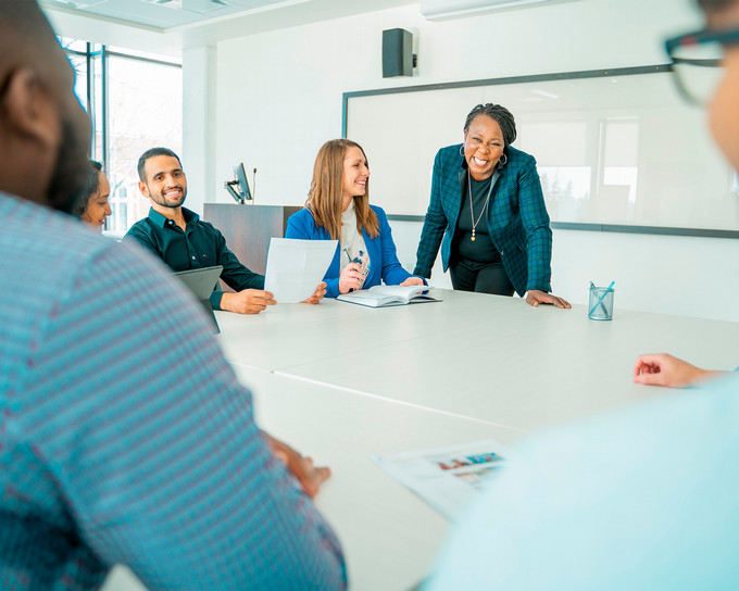Students in a classroom doing a white board exercise
