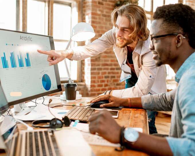 Students in a classroom doing a white board exercise