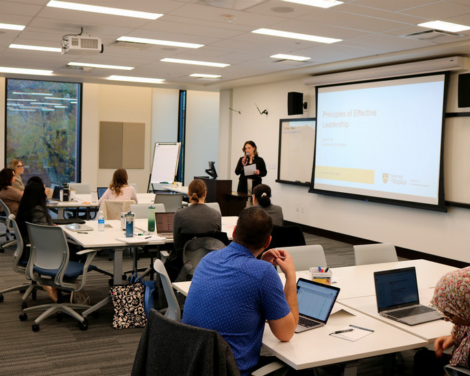 Students in a classroom doing a white board exercise