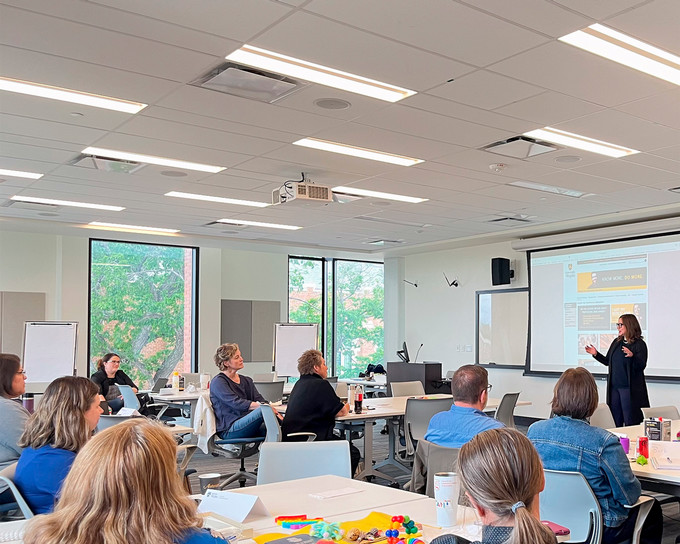 Students in a classroom doing a white board exercise