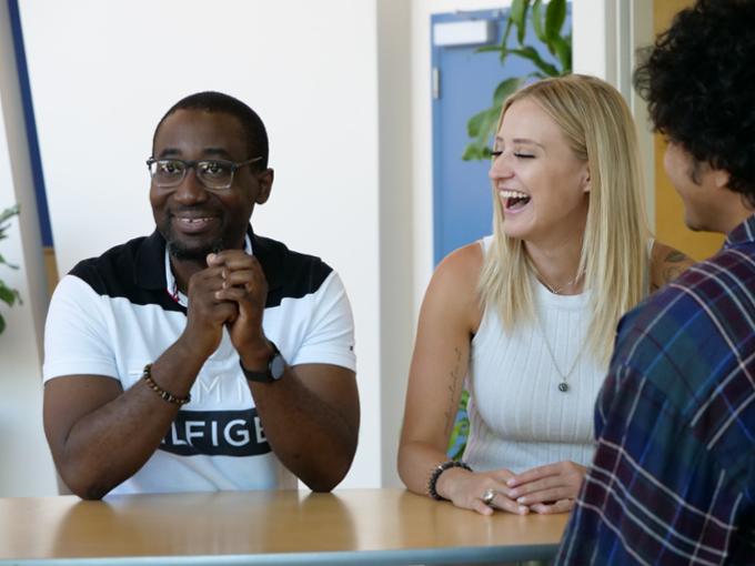 Three smiling students.