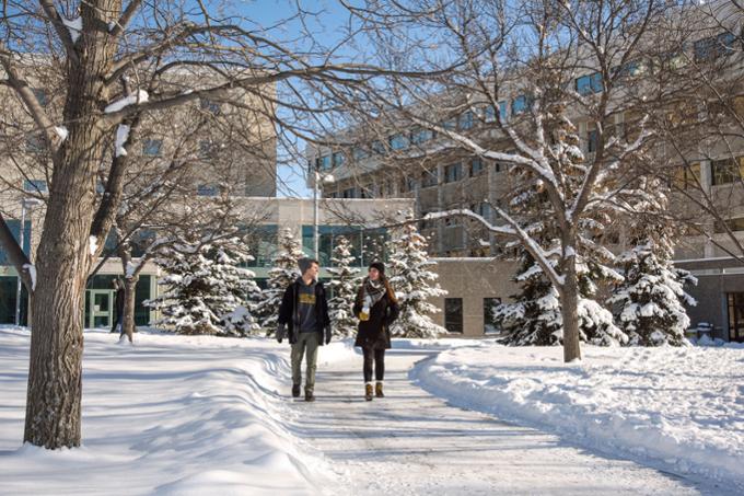 Students walking on campus in winter