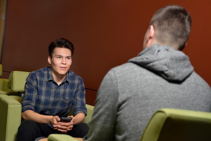 Two students sitting and talking