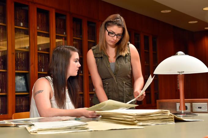 Twp students studying together at table 