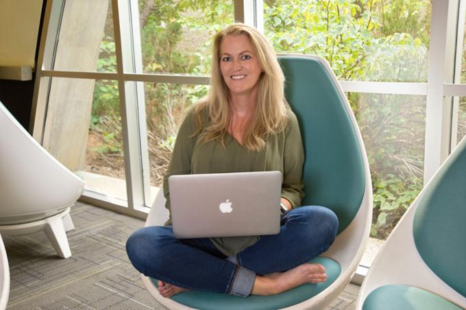 Woman sitting with laptop