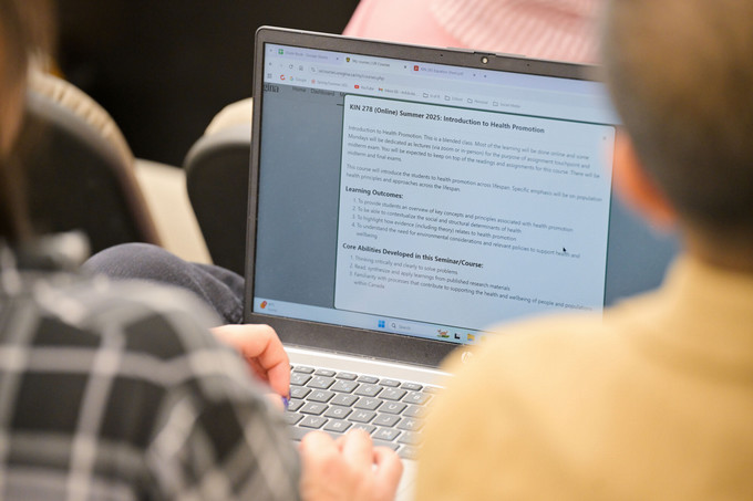 Close-up of a student’s laptop displaying an open Word document on the screen.