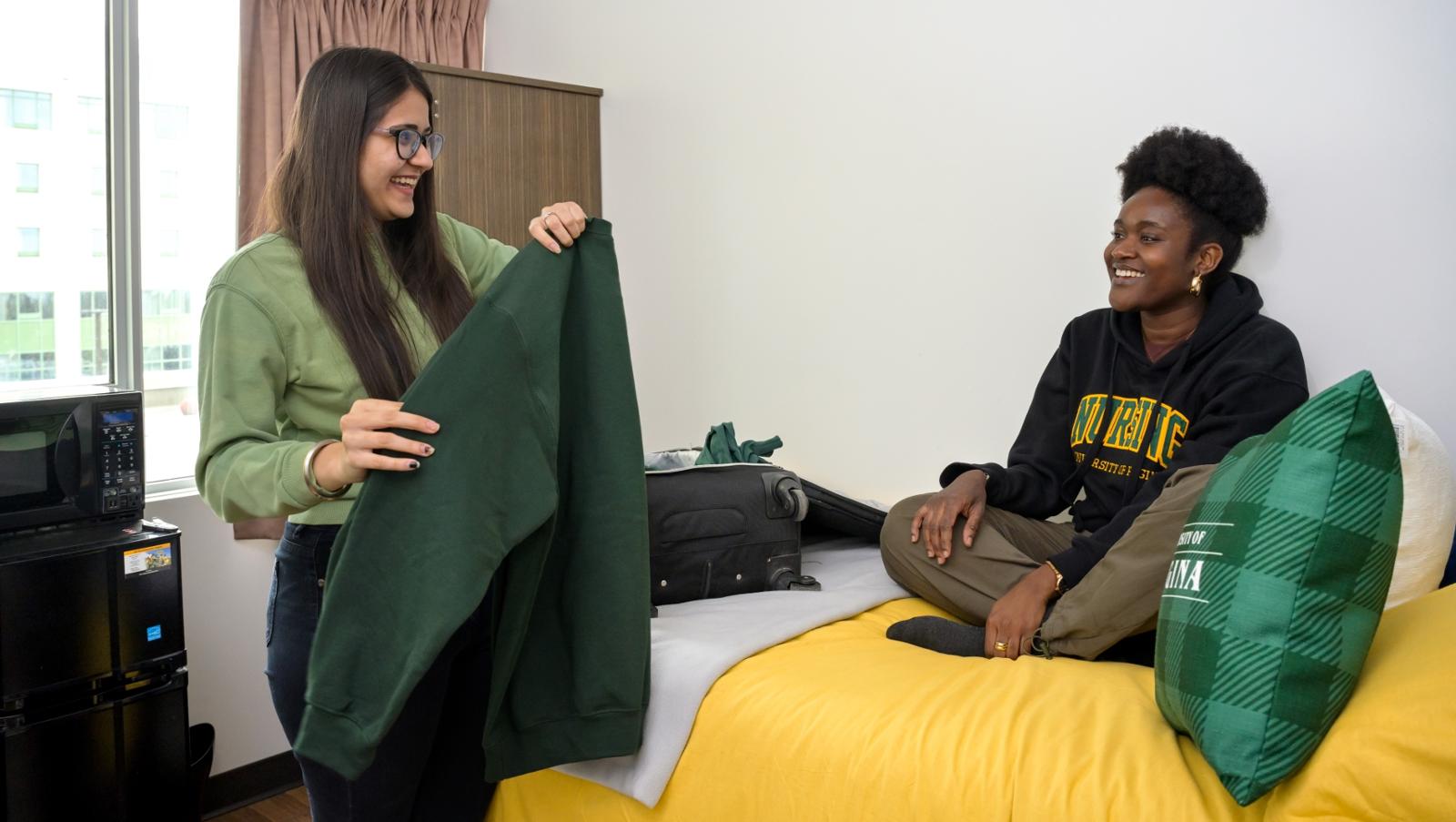 Smiling individuals in dorm