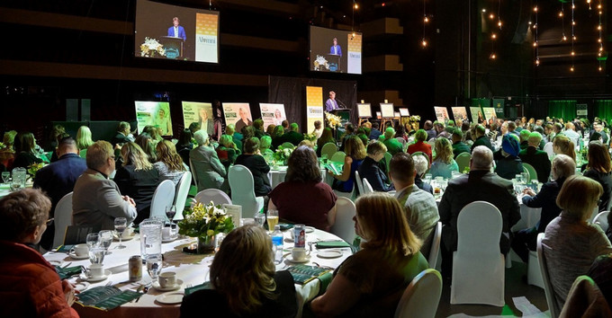 people seated at table at an awards gala