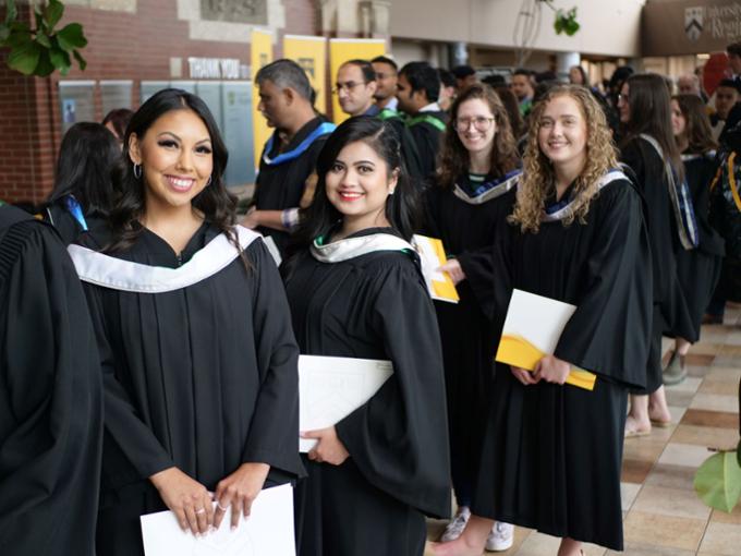 grads in line at convocation ceremony