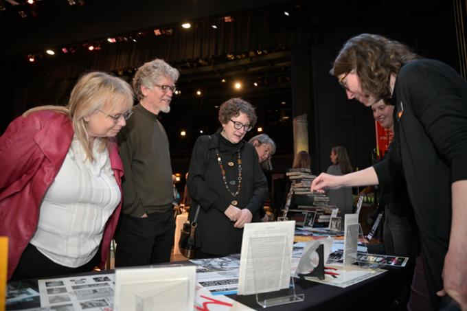 Guests view the archival materials, programs