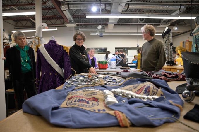 Guests visit the wardrobe room where costumes are designed and made