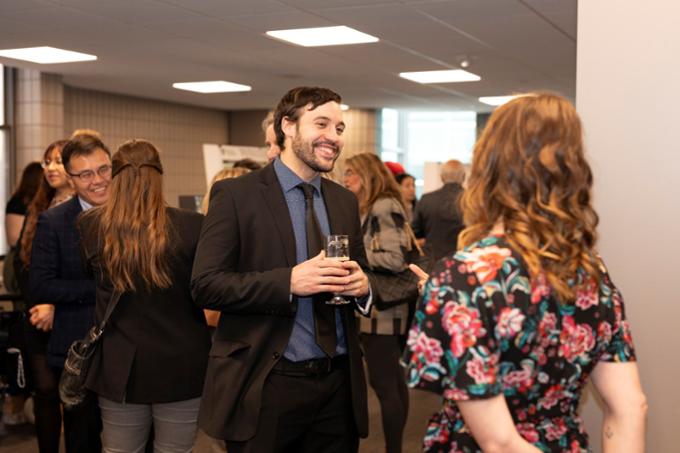 Two people speaking at event