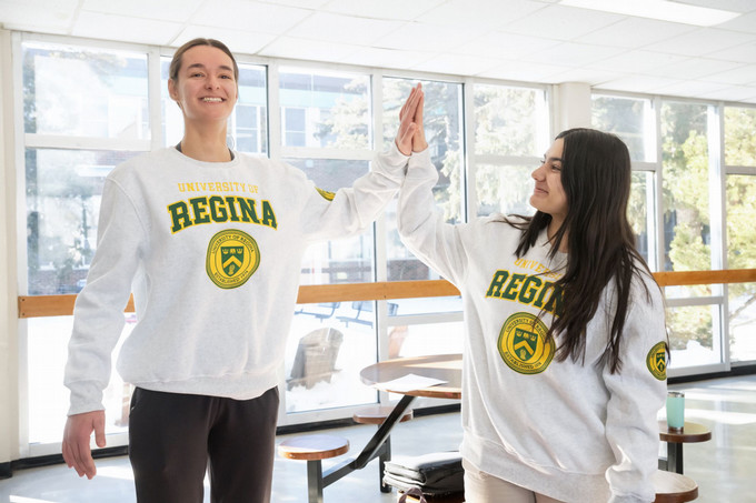 Two students high fiving