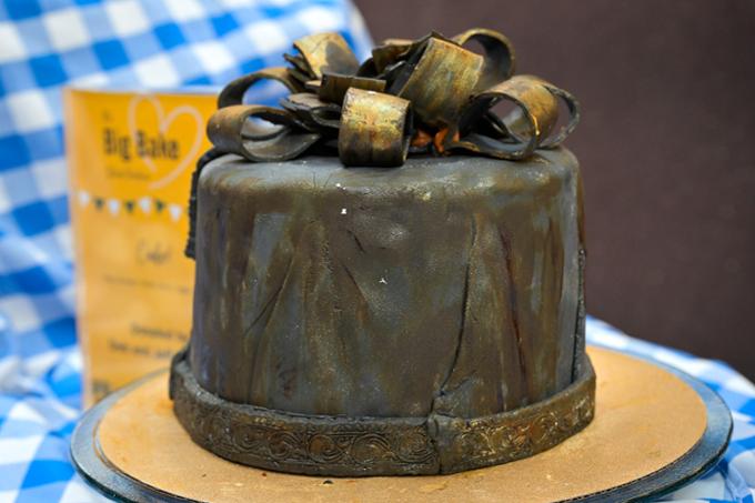 chocolate cake with a gold bow on top