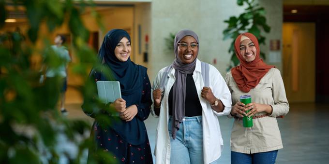 Three students walking