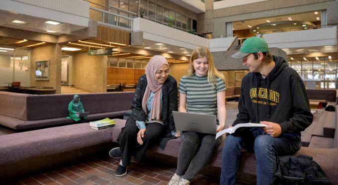 Three students studying in the AdHum Conversation Pit