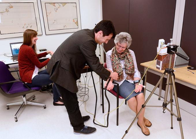 Researchers work with a patient