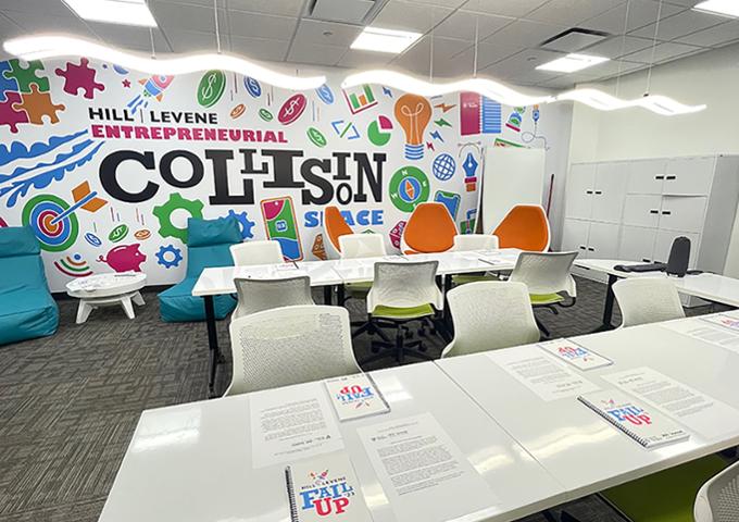 An empty meeting room with with notebooks and papers on the tables