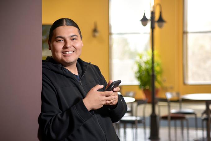 A student stands in a common area