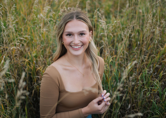 Woman stands in field