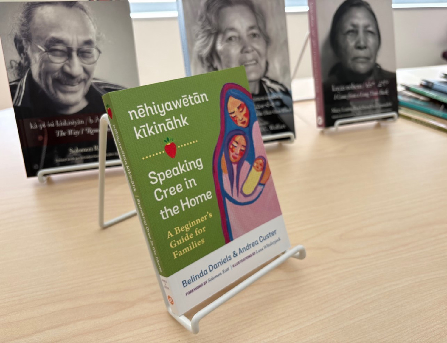 Four books featuring Indigenous authors are displayed on a table.