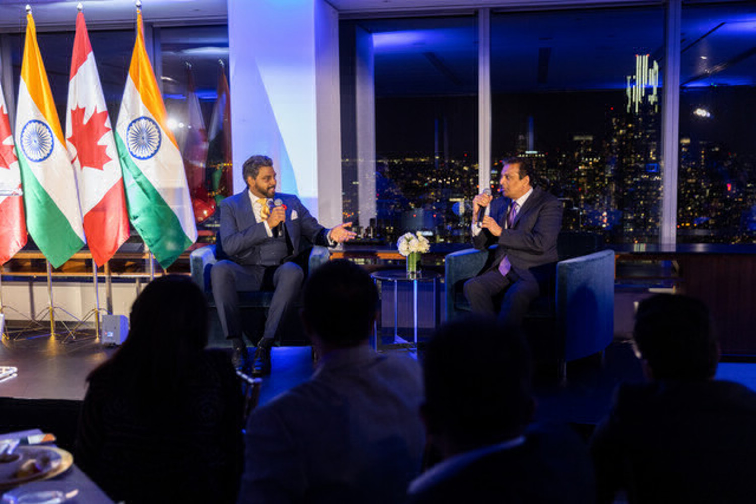 Two men on stage in interview