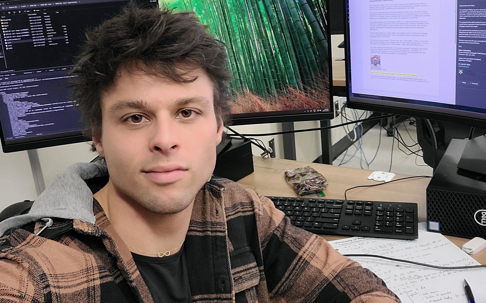 Man sitting at computer desk.