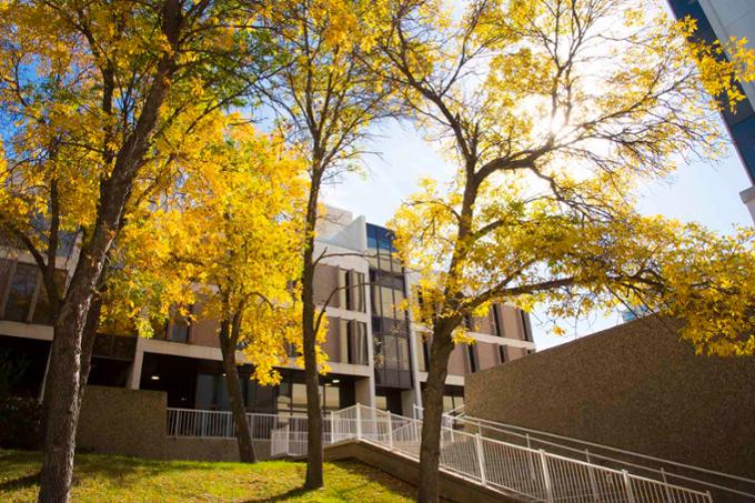 The sun shining on the Administrative Humanities Building on the University of Regina Campus during an autumn day