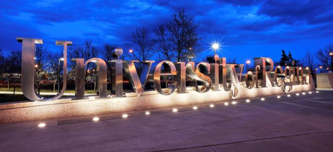 The University of Regina lit up at night.