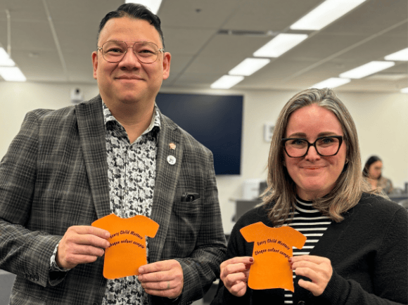 Jada Yee and Erin Oldford holding orange shirt day notes for personal calls to action