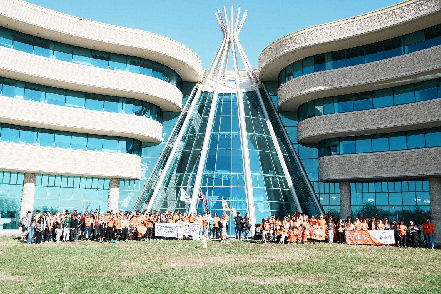 Community gathered in front of First Nations University of Canada after the Smudge Walk