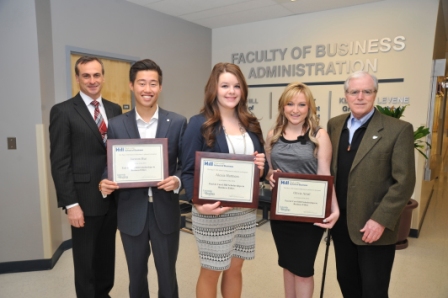 Dean Andrew Gaudes and Paul Hill with recipients of the Paul and Carol Hill Scholarship in Business Ethics on December 2