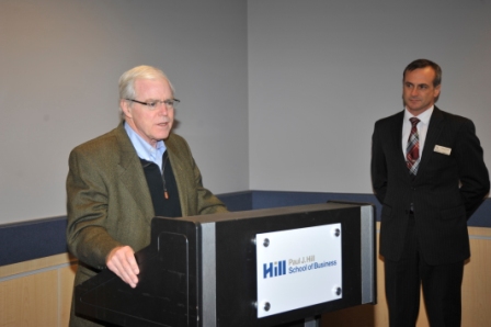 Paul Hill addresses recipients of the Paul and Carol Hill Scholarship in Business Ethics at an event hosted by the Hill School of Business December 2