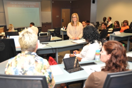 Rachel Mielke, Founder &amp; CEO of Hillberg &amp; Berk works with students in Gina Grandy's leadership class on June 24
