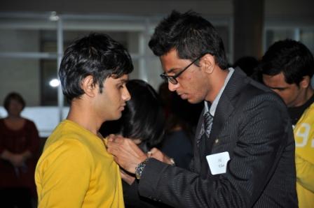 Students pin each other at the Hill Legacy Pinning Ceremony on January 24.