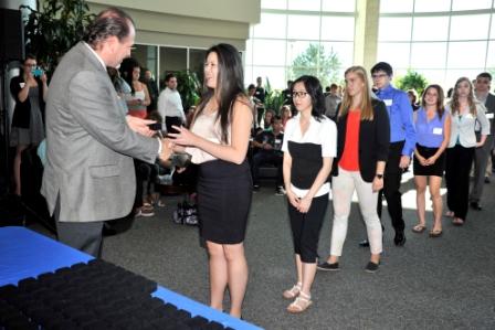 Associate Dean, Brian Schumacher, hands out Hill Legacy Pins to recipients at the Ceremony on September 20.