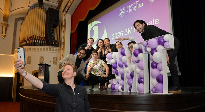 taking a group selfie at an event
