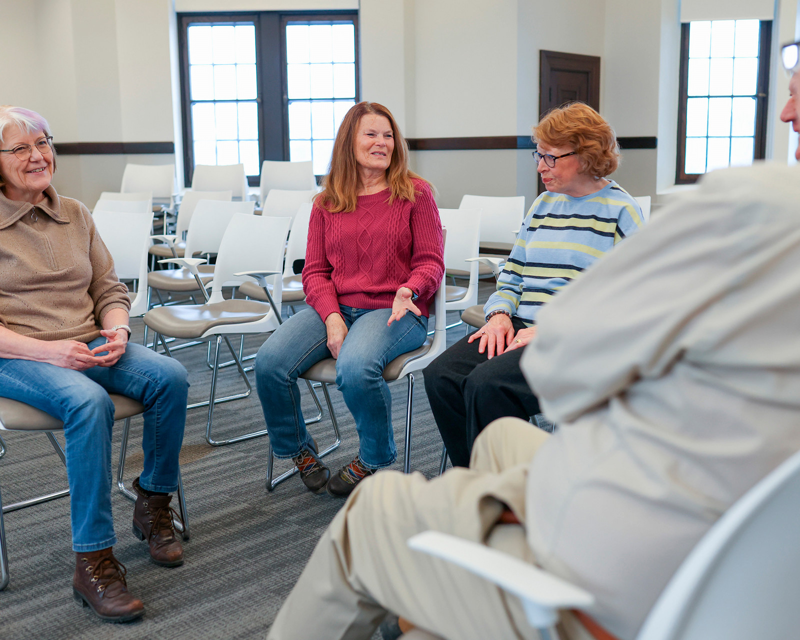 Four older students in a classroom