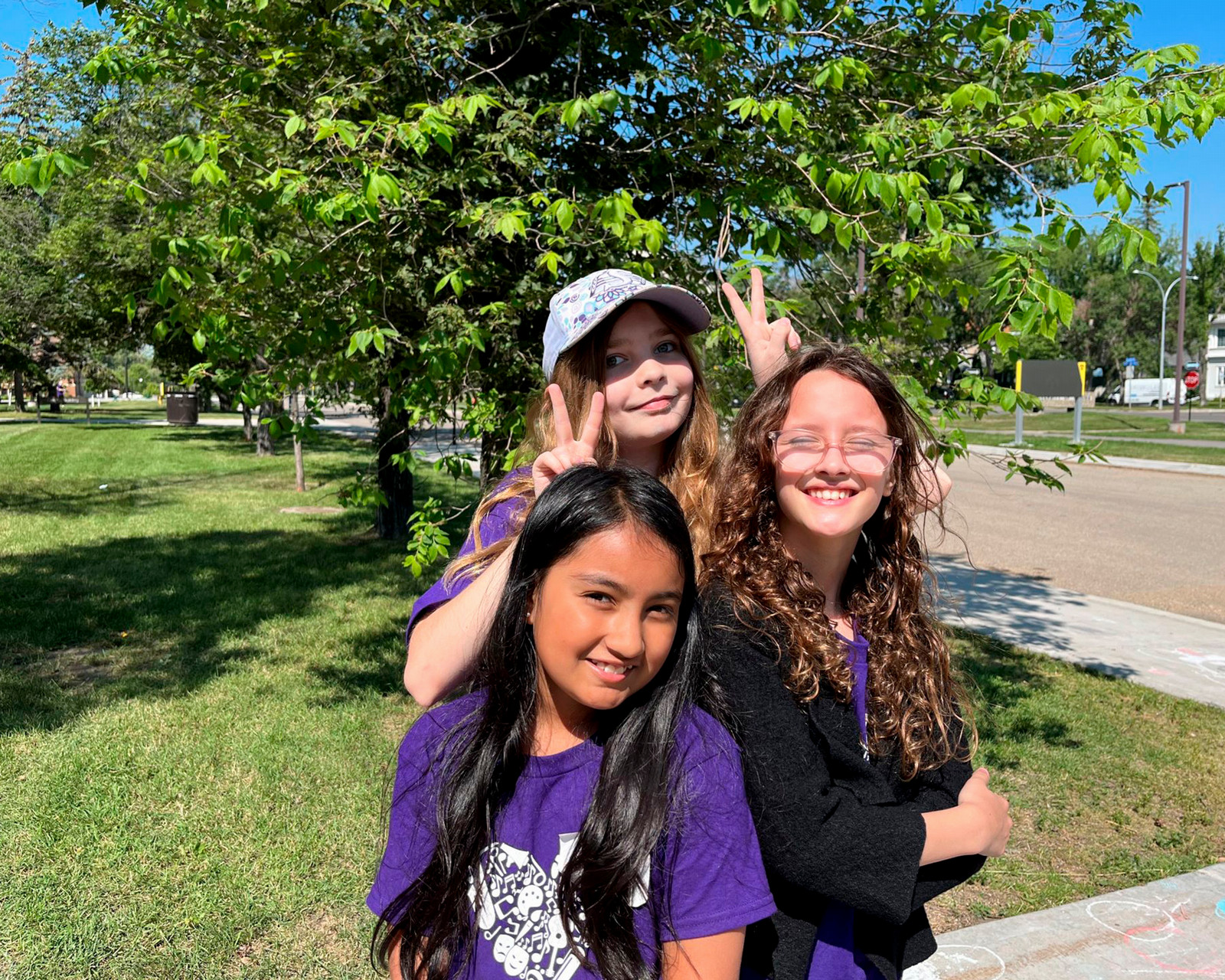 Three camp kids pose for a photo